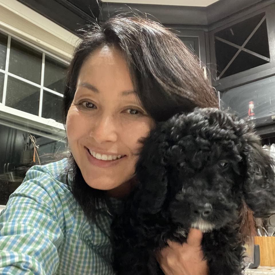 Yukiko Dove, Founder and CEO, with Nami the Goldendoodle
